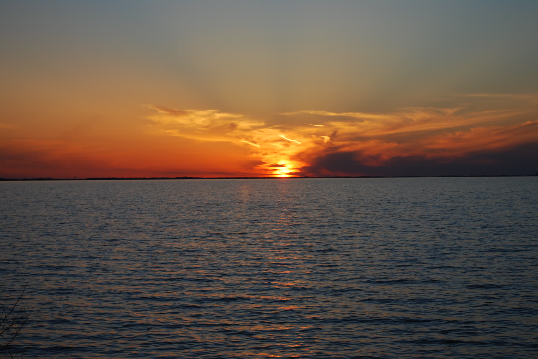 The sun setting over open water on Lake Erie