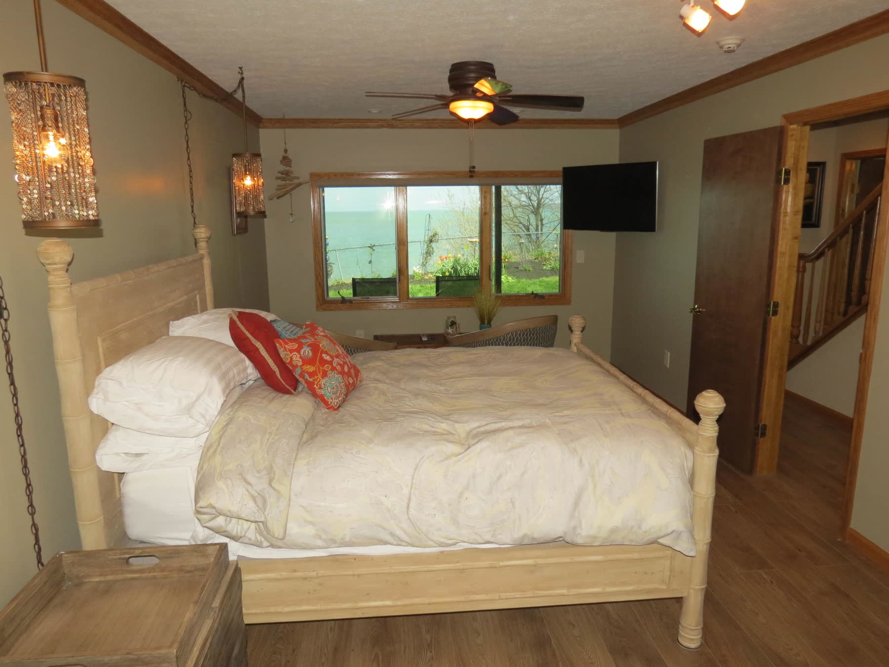 The Beachfront room, with a wide window onto Lake Erie and the garden